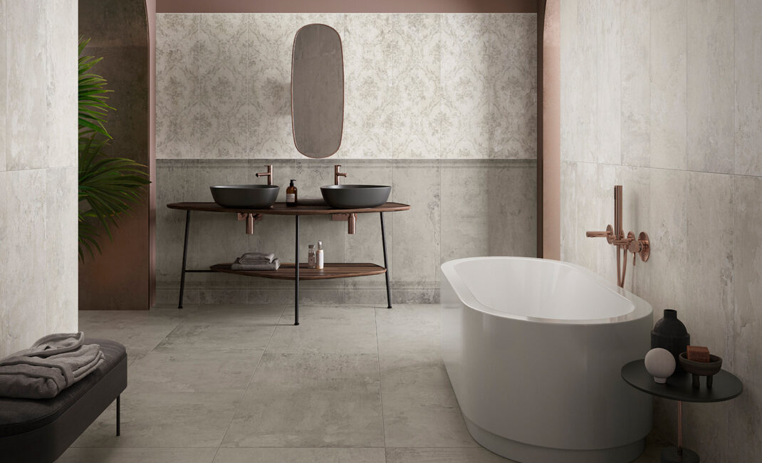 Modern bathroom featuring a freestanding tub, dual sinks, and stylish decor elements.