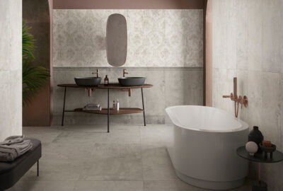 Modern bathroom featuring a freestanding tub, dual sinks, and stylish decor elements.
