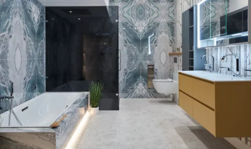 Modern bathroom featuring marble walls, a freestanding tub, shower, and minimalist cabinetry.