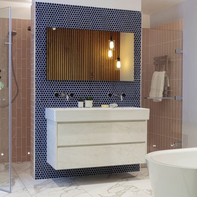 Modern bathroom with a floating vanity unit, marble effect floor tiles, blue hexagonal mosaic wall tiles, wooden slat feature wall, and glass-enclosed shower with blush pink tiles