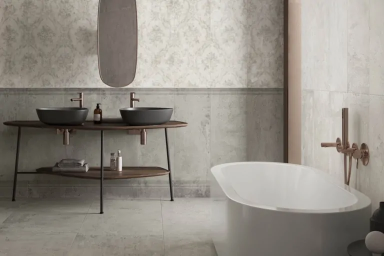 Bathroom with two black sinks, wooden counter, patterned tiles, and a freestanding bathtub.