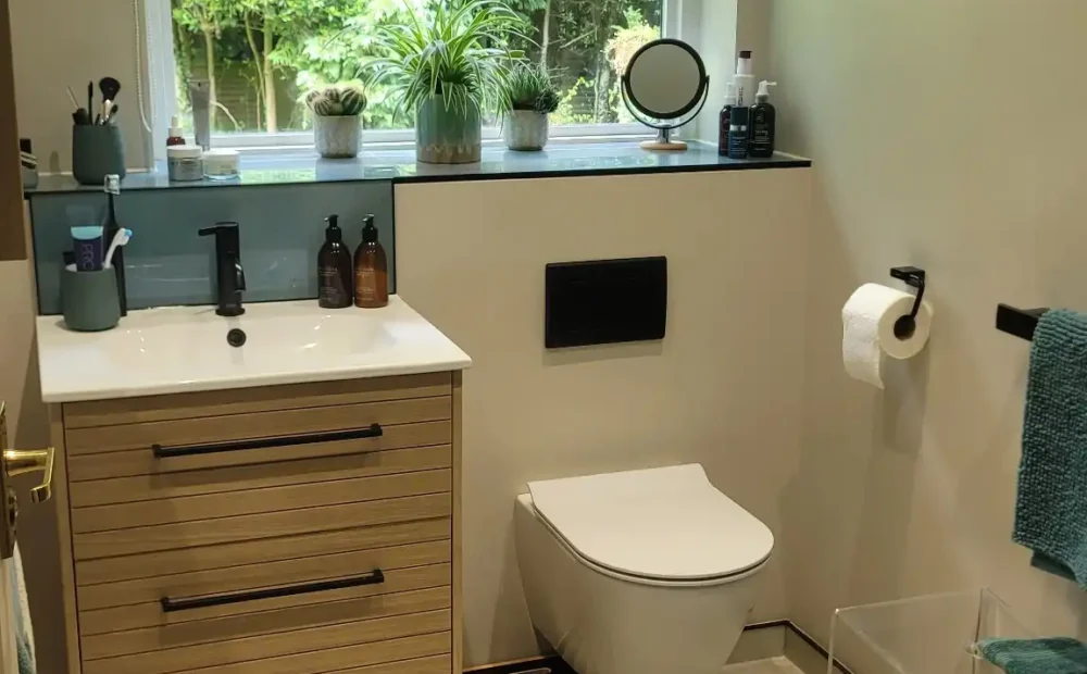 Stylish bathroom with wall-hung toilet and large window.