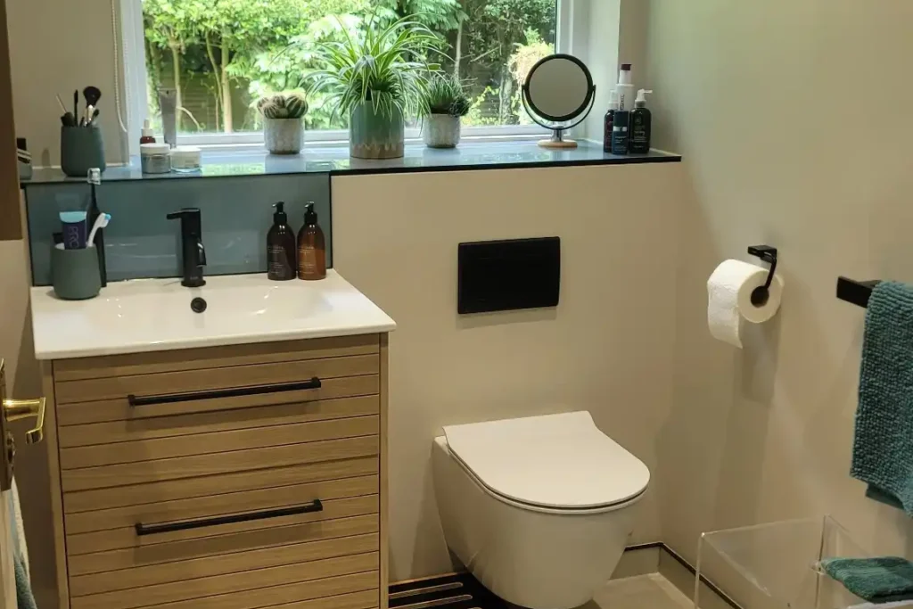Stylish bathroom with wall-hung toilet and large window.
