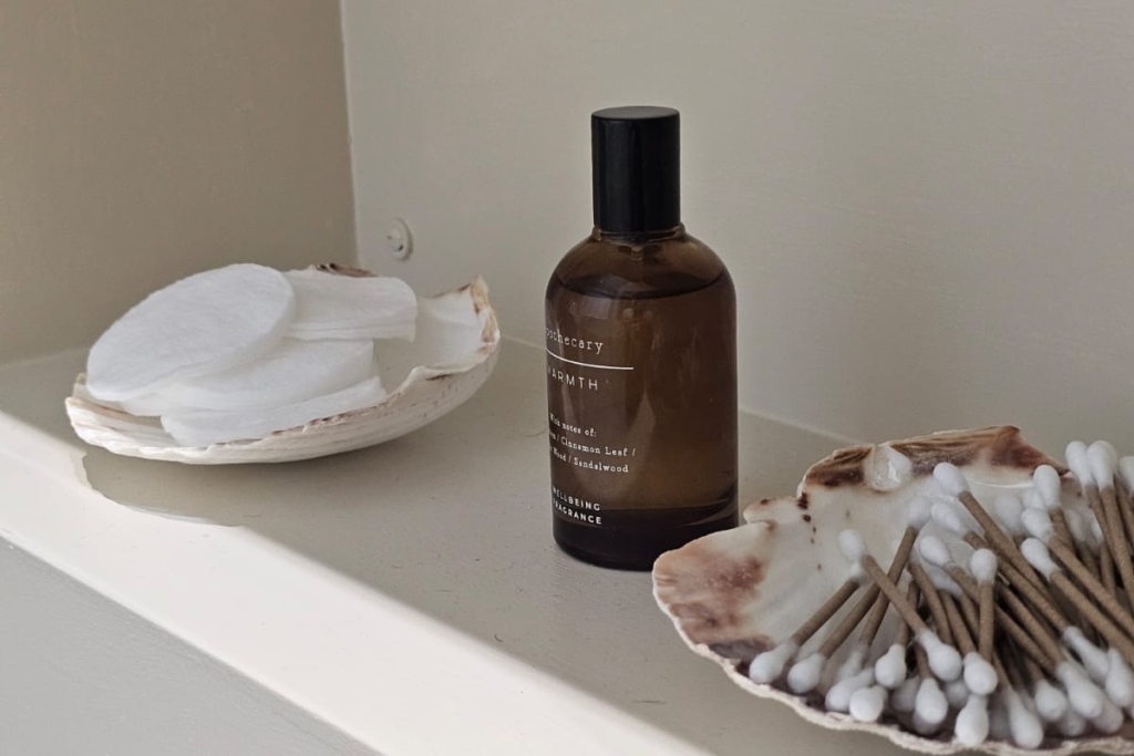 Built-in bathroom shelf with decorative accessories and toiletries