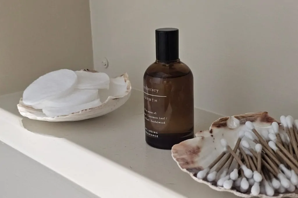 Built-in bathroom shelf with decorative accessories and toiletries
