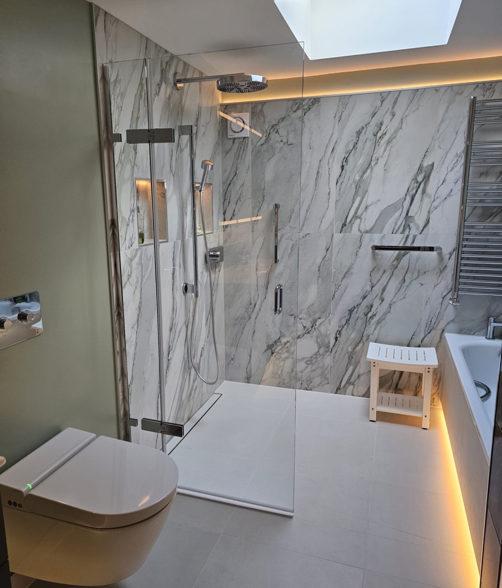 Accessible wet room with walk-in shower, marble-effect wall tiles and skylight
