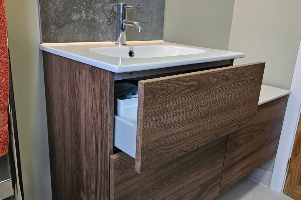 Wood-effect wall-hung vanity with integrated basin and illuminated mirror